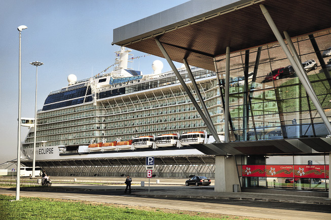 Celebrity Eclipse by a cruise terminal. Bus parking is nearby.